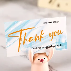 Detailed view of a blue marble thank you card for customer appreciation orders