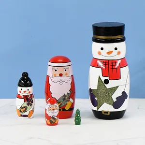 Handmade wooden Christmas nesting dolls set featuring Santa and snowman figures