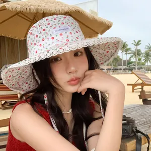 Floral print bucket sun hat with lace trim and wide brim for women's summer beach wear