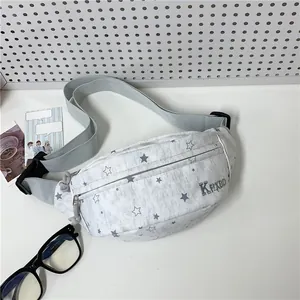 Close-up view of a trendy gray fanny pack featuring a stylish star pattern and KPLXBD logo