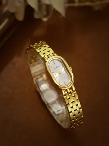 Elegante reloj de mujer en acero inoxidable dorado con esfera ovalada retro y brazalete