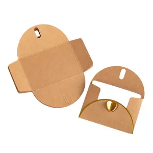 Vintage brown kraft paper envelope featuring a gold foil heart clasp for greeting cards