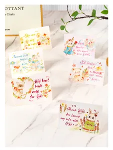 Detailed view of hand-painted watercolor greeting cards with cute cartoon animal designs