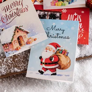 Assorted Christmas greeting cards featuring festive Santa Claus and snow house illustrations