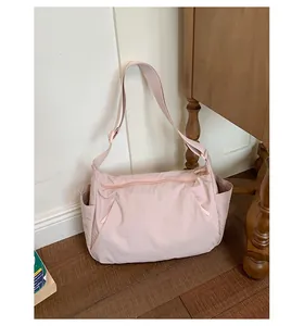 Minimalist large capacity lightweight crossbody shoulder bag in soft pink nylon fabric