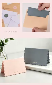 Detailed view of Morandi-style thank you cards and envelopes with gold bronzing foil