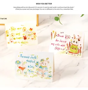 Close-up of cute watercolor greeting cards with hand-painted animal illustrations.