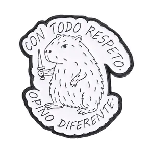 Whimsical capybara enamel pin featuring a knife and 'CON TODO RESPETO' Spanish quote
