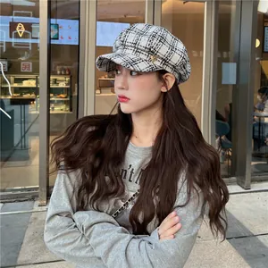 Stylish women's plaid newsboy cap in black and white tweed, perfect for autumn and winter.