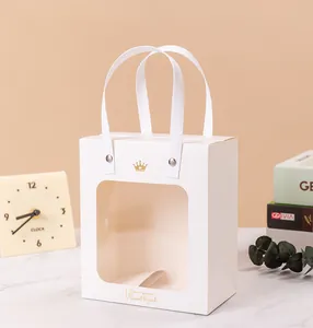 White gift bag with transparent window and gold crown logo for weddings and parties.