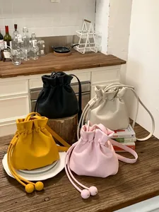 Chic candy-colored drawstring bucket bags in four colors for spring and summer