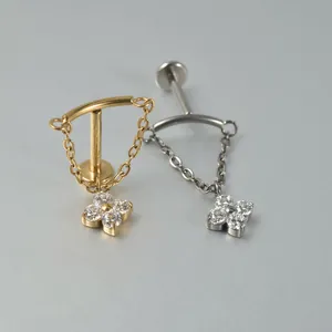 Detail of G23 titanium chain earrings with sparkling flower zirconia pendants.