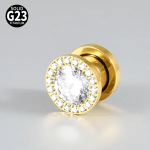 Macro detail of G23 titanium ear tunnel with sparkling cubic zirconia pavé