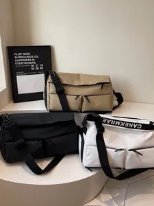 Trendy multi-pocket crossbody sports bags in black, khaki, and white for travel
