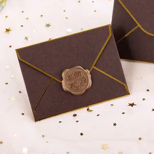 Elegant brown paper envelope with decorative gold borders and a Thank You wax seal