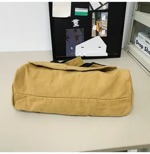 Minimalist mustard yellow canvas messenger bag featuring a high quality large capacity design