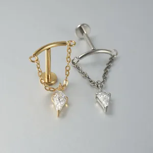 Detailed view of G23 titanium chain labret studs with kite-cut crystals in gold and silver.