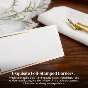 Elegant white wedding place cards featuring exquisite gold foil-stamped borders and framing