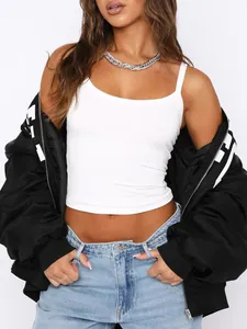 Close-up detail of a white ribbed camisole tank top styled in a trendy Y2K fashion look