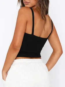 Rear view of black spaghetti strap crop top paired with white sweatpants for women