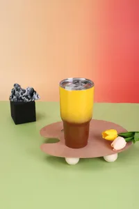 Close-up of 30oz gradient yellow and brown stainless steel vacuum insulated tumbler
