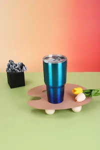 Macro view of 30oz teal blue gradient stainless steel vacuum insulated tumbler.
