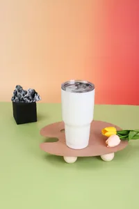 30oz white stainless steel vacuum insulated tumbler on creative wooden palette stand