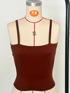 Detail view of a brown Y2K spaghetti strap camisole tank top shown on a tailor mannequin