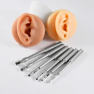 Professional 316L stainless steel skin piercing punch tool set with silicone ear models