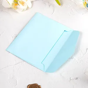 Light blue western-style paper envelope for greeting cards on white textured background