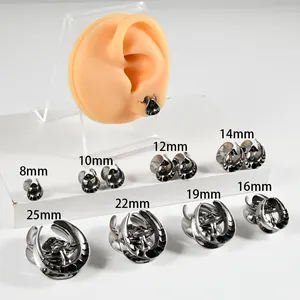 Detailed view of mushroom-patterned stainless steel ear gauges in various sizes from 8mm to 25mm