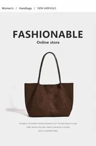 Close-up of vintage brown suede tote bag with minimalist stitched design detail