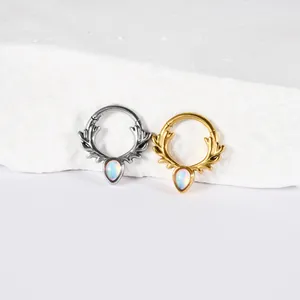 Close-up of stainless steel antler septum rings with iridescent water-drop stones