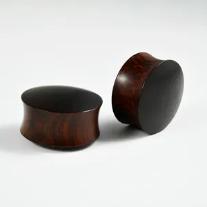 Detailed macro view of solid organic wood ear plugs with rich natural wood grain