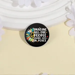 Detailed macro view of the sunflower peace brooch with Imagine all the people quote.