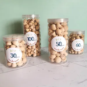 Detail showing four jars of unpainted wooden mushrooms in different quantities for DIY painting