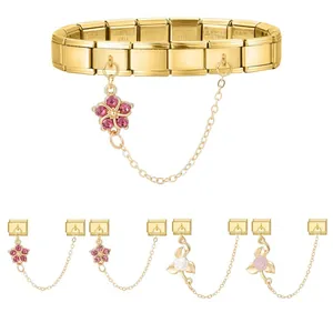 Detailed macro view of gold Italian modular charm bracelet with elegant flower pendants