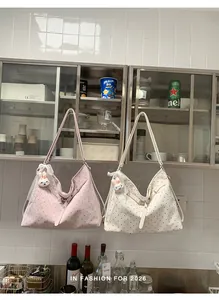 Stylish polka dot large capacity tote bags in pink and white hanging in a kitchen