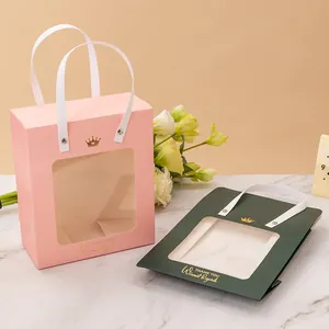 Elegant gold foil gift bag with transparent window and ribbon handle for weddings