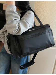 Large capacity black travel duffel bag for gym and fitness with adjustable strap