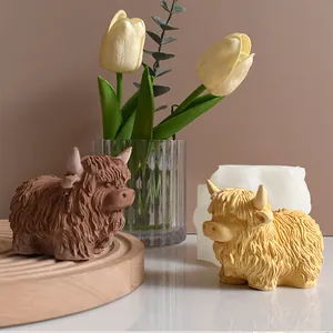 Detailed view of creative Highland cow silicone mold with finished brown resin statues