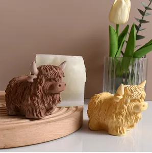 Highland cow silicone mold with finished brown and yellow resin cow statues for home decor