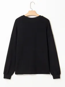 Detailed rear view of a comfortable black ribbed long-sleeved pullover sweatshirt for women.