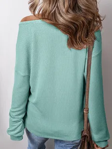Detail view showing back of women's teal waffle-knit long-sleeved pullover sweatshirt