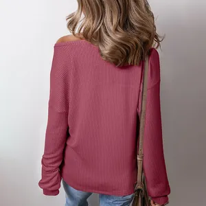 Back view of woman wearing dusty pink off-shoulder waffle knit long sleeve top