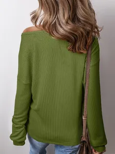 Back view detail of a women's green waffle-knit long sleeve casual pullover top.