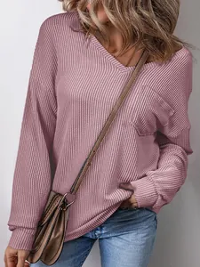 Close-up view of women's mauve waffle knit V-neck sweatshirt with a functional chest pocket