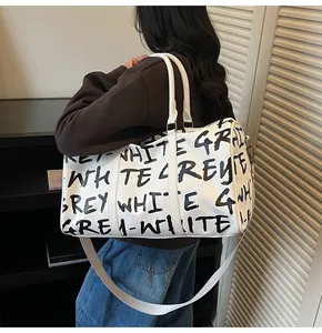 Stylish large capacity white travel bag with black graffiti letter print for women
