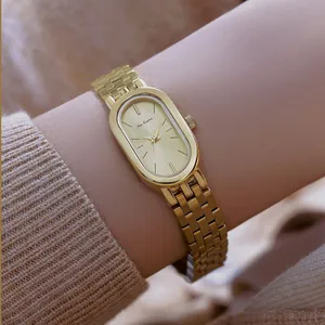 Elegante reloj vintage de acero inoxidable dorado para mujer con esfera ovalada y brazalete