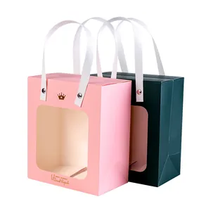 Elegant gift bags with transparent window and gold crown logo for weddings and parties